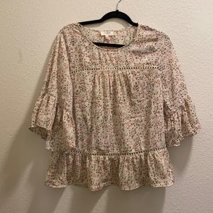 Never worn! Bell sleeve blouse with floral pattern and details throughout